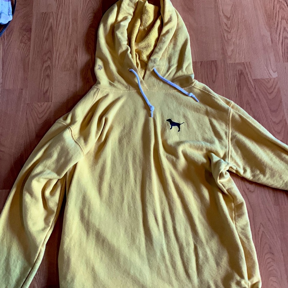 This is a pink sweater in the color musters yellow!